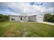 Single-story home with attached garage and grassy yard at 19196 Raymond Ave, Port Charlotte, FL 33954