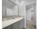 Bathroom with grey cabinets and quartz countertop at 19196 Raymond Ave, Port Charlotte, FL 33954