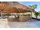 Covered outdoor bar with seating area at 915 Allen Ave, Englewood, FL 34223