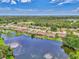 Expansive aerial view of a lakefront community at 264 Park Forest Blvd, Englewood, FL 34223