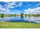 Community lakefront property with lush green spaces at 264 Park Forest Blvd, Englewood, FL 34223