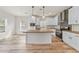 Modern kitchen with white cabinets, butcher block island, and stainless steel appliances at 18085 Ardmore Ave, Port Charlotte, FL 33954