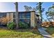 Condo unit with a private screened patio and lush landscaping at 19 Quails Run Blvd # 2, Englewood, FL 34223