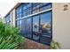 View of condo exterior with screened-in patio at 19 Quails Run Blvd # 2, Englewood, FL 34223