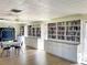 Community library featuring built-in bookshelves at 19 Quails Run Blvd # 2, Englewood, FL 34223