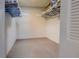 Spacious walk-in closet with ample shelving and hanging space at 19 Quails Run Blvd # 2, Englewood, FL 34223