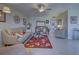 Spacious living room with comfortable seating and a large TV at 19 Quails Run Blvd # 2, Englewood, FL 34223