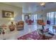 Open living room with view of dining area and access to patio at 19 Quails Run Blvd # 2, Englewood, FL 34223