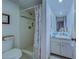 Clean bathroom with shower/tub combo and vanity at 19 Quails Run Blvd # 2, Englewood, FL 34223
