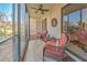 Bright screened patio offers comfy seating and view of the garden at 19 Quails Run Blvd # 2, Englewood, FL 34223