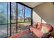 Peaceful screened patio with comfortable seating and garden view at 19 Quails Run Blvd # 2, Englewood, FL 34223