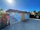 Community pool bathhouse with painted mural at 19 Quails Run Blvd # 2, Englewood, FL 34223