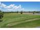 Aerial view of a spacious driving range with ample space for golfers to practice at 268 Broadmoor Ln, Rotonda West, FL 33947