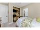 Charming bedroom with a four-poster bed and built-in office space at 13077 Rinella St, Venice, FL 34293
