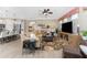 Bright living room with a large sectional sofa and flat-screen TV at 13077 Rinella St, Venice, FL 34293