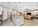 Open concept kitchen with island seating, overlooking the living room at 13077 Rinella St, Venice, FL 34293