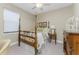 Cozy bedroom with a four-poster bed and built-in workspace at 13077 Rinella St, Venice, FL 34293