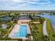 Aerial view showing pool, tennis courts, and community at 13077 Rinella St, Venice, FL 34293