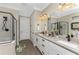 Modern bathroom with double sinks, walk-in shower, and stylish decor at 13077 Rinella St, Venice, FL 34293