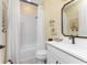 Clean bathroom with a bathtub, white vanity, and updated fixtures at 13077 Rinella St, Venice, FL 34293