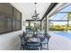 Outdoor dining area with pool access at 13077 Rinella St, Venice, FL 34293