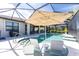 Relaxing pool area with covered patio at 13077 Rinella St, Venice, FL 34293