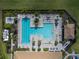 Overhead view of resort-style pool with lap lanes and plenty of lounge chairs at 13077 Rinella St, Venice, FL 34293