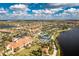 Aerial view of community with lake and various amenities at 13077 Rinella St, Venice, FL 34293