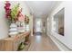 Bright and spacious entryway with a large mirror and wooden console table at 13077 Rinella St, Venice, FL 34293