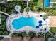 Aerial view of resort-style pool with many amenities at 13077 Rinella St, Venice, FL 34293