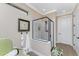 Elegant bathroom with a glass shower, modern vanity, and a tranquil atmosphere at 13077 Rinella St, Venice, FL 34293