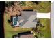 Top-down view of a single-Gathering home with a private pool and surrounding landscaping at 127 Marker Rd, Rotonda West, FL 33947