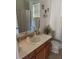 Bathroom with single sink vanity, toilet, and shower at 2704 Suncoast Lakes Blvd, Punta Gorda, FL 33980