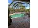 Relaxing screened-in pool and spa area with brick pavers at 2704 Suncoast Lakes Blvd, Punta Gorda, FL 33980