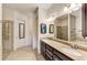 Double vanity bathroom with granite countertops and large shower at 13104 Creekside Ln, Port Charlotte, FL 33953