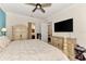 Spacious bedroom with large bed, dresser, and TV at 13104 Creekside Ln, Port Charlotte, FL 33953
