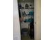 Well-organized laundry closet with shelving at 26 Quails Run Blvd # 7, Englewood, FL 34223