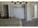 Bedroom with a walk-in closet and carpeting at 26 Quails Run Blvd # 7, Englewood, FL 34223