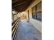Covered balcony with stone tile flooring at 26 Quails Run Blvd # 7, Englewood, FL 34223