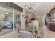 Breakfast nook with glass table, four chairs, and access to screened patio at 13033 N Marsh Dr, Port Charlotte, FL 33953
