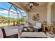 Spacious screened patio, wicker furniture, nature views at 13033 N Marsh Dr, Port Charlotte, FL 33953