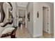 Spacious entryway with mirror and view to living room at 13033 N Marsh Dr, Port Charlotte, FL 33953
