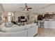 Open living space with sectional sofa and kitchen access at 13033 N Marsh Dr, Port Charlotte, FL 33953