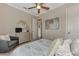 Bedroom with ceiling fan, dresser, and comfortable bed at 13033 N Marsh Dr, Port Charlotte, FL 33953