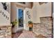 Inviting front entrance with decorative door and stone accents at 13033 N Marsh Dr, Port Charlotte, FL 33953
