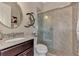 Bathroom with granite vanity, toilet, and walk-in shower at 13033 N Marsh Dr, Port Charlotte, FL 33953