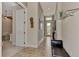Bright and airy entryway with tile flooring and seating at 13033 N Marsh Dr, Port Charlotte, FL 33953