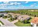 Aerial view of houses and a waterfront in a quiet residential neighborhood at 13033 North Marsh Dr, Port Charlotte, FL 33953