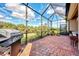 Enjoy grilling and relaxing in this screened patio at 13033 N Marsh Dr, Port Charlotte, FL 33953