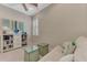 Home office featuring built-in shelving and a comfortable sitting area at 13033 N Marsh Dr, Port Charlotte, FL 33953